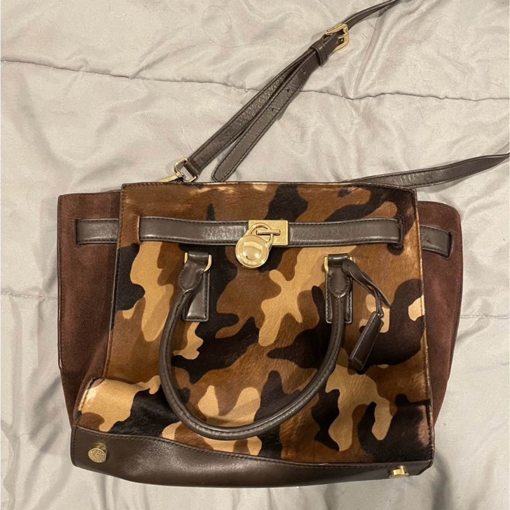 Michael Kors hand bag with long strap attached. Cameo print with brown leather.
